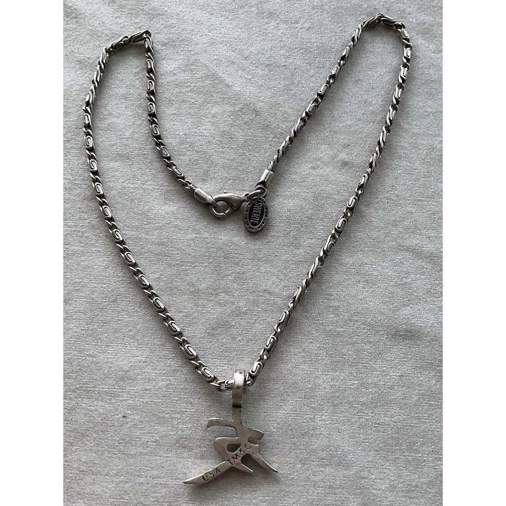 silver-tone chain necklace with an Asian kanji character pendant By SWERTE